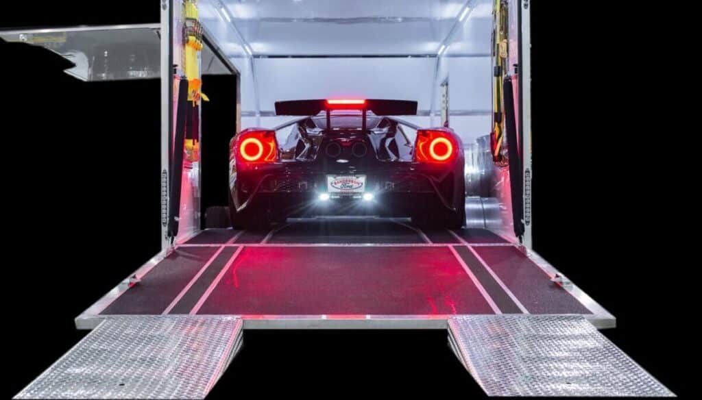 Sports car inside an enclosed trailer