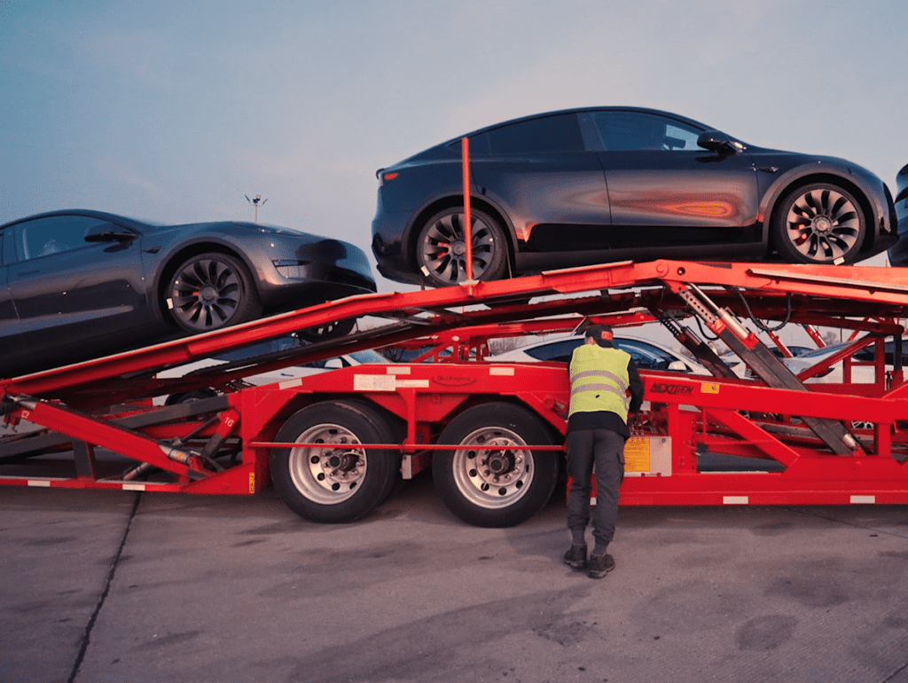 SDM Transport driver loading cars onto a car hauler